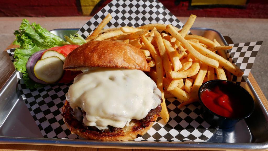 Pub Burger · Juicy beef patty, red door blonde ale braised onions, garlic aioli, and provolone on a toasted bun. Served with fries.