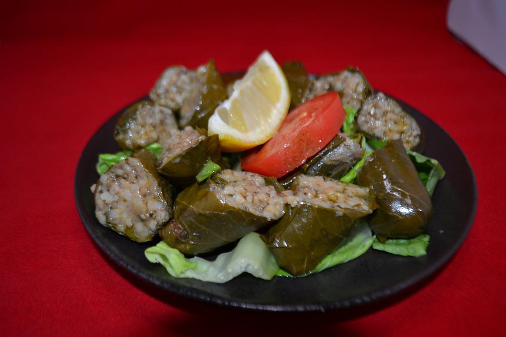 Stuffed Grape Leaves · Grape leaves stuffed with rice, fresh parsley and mint. (Comes with 6)