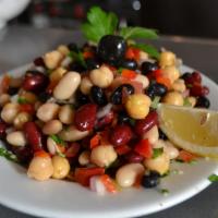 Piyaz · White beans, red beans, red pepper, green pepper, parsley, red onion and chickpeas marinated...