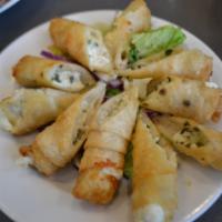 5 Piece Feta Cheese Roll · Delicate filo dough wrapped with feta cheese and parsley, deep fried.