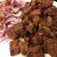 Calf's Liver · Cubes of calf's liver lightly pan fried in vegetable oil served with red onion, tomato and s...