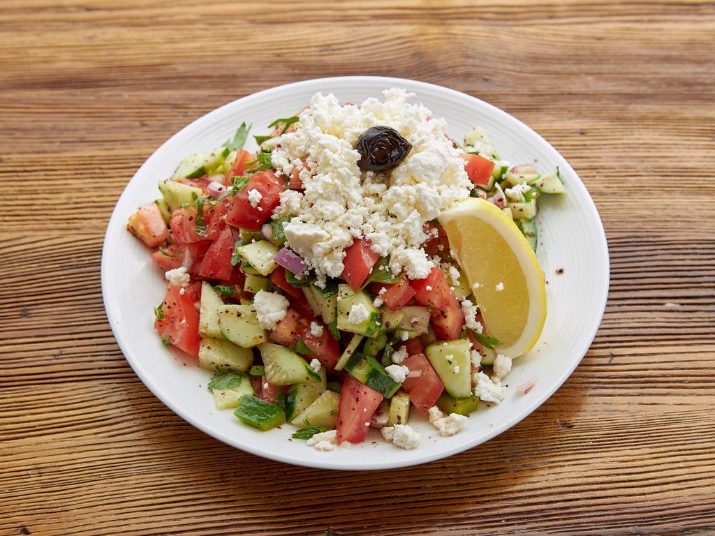 Shepherd's Salad · Fresh tomatoes, Kirby, green peppers, onions, parsley, olive oil and lemon juice.
