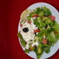 Mediterranean Salad · Fresh tomatoes, iceberg lettuce, green peppers, Kirby topped with feta cheese, olive oil and...