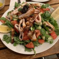 Calamari Salad · Arugula, Kirby, tomato, onion, lemon juice and olive oil topped with grilled calamari.