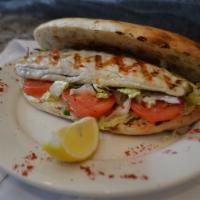 Bronzini Sandwich · Homemade bread. Comes with red cabbage, iceberg lettuce, tomato, onion, parsley, olive oil a...