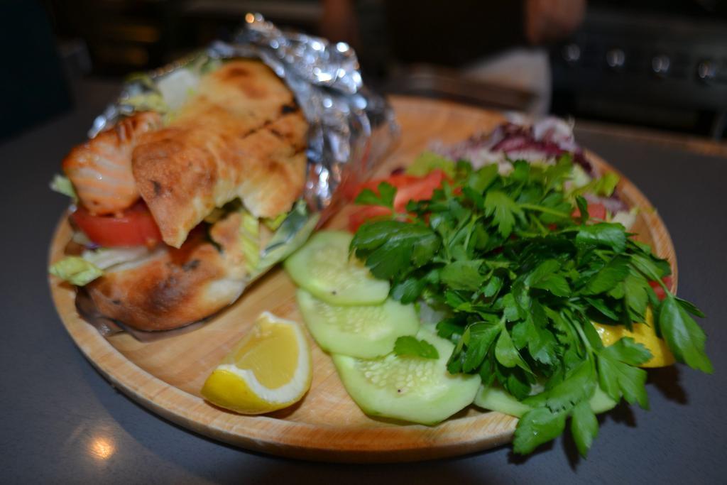 Salmon Sandwich · Homemade bread. Comes with red cabbage, iceberg lettuce, tomato, onion, parsley, olive oil and lemon juice.