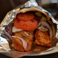 Chicken Adana Sandwich · Comes with red cabbage, iceberg lettuce, tomato, onion, parsley, olive oil and lemon juice.