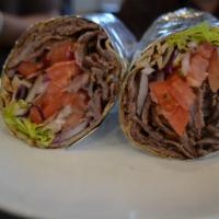 Doner wrap · Tender lamb, grilled vertically and thinly sliced with lettuce, onion and sliced tomatoes wi...