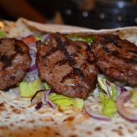 Kofte Wrap · Ground meat mixed with bread, onion, parsley and garlic. Served with lettuce, onion, tomatoe...