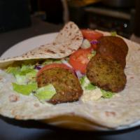 Falafel Wrap · A mixture of chickpeas, celery, parsley and green onions tossed in spices and fried. Served ...