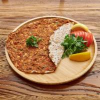 Lahmacun · Meat pie. Anatolia's version of ancient Turkish meat pie with ground lamb, topped with parsl...