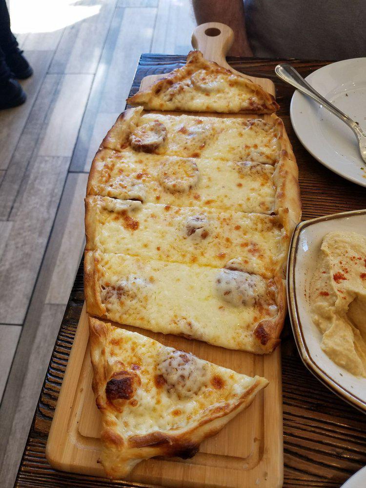 Sausage and Cheese Pide · A thin crust topped with Turkish sucuk and mozzarella cheese.