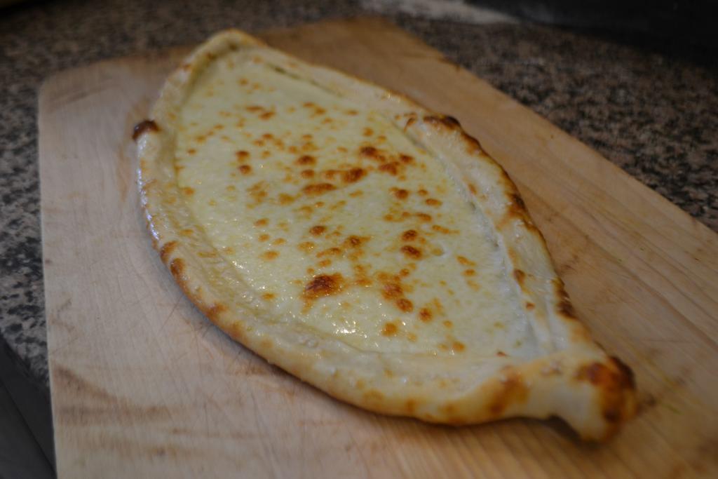 Mozzarella Pide · Crispy crust of dough topped with mozzarella cheese.