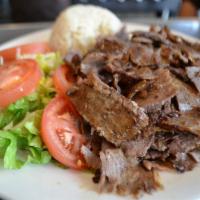 Gyro · Layers of marinated ground meat, wrapped around the large vertical split and grilled in fron...