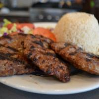 Kofte Kebab · Ground meat mixed with bread, onion and garlic. Served with salad and side.