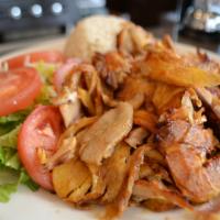 Chicken Gyro · Layers of marinated chicken thighs wrapped around the large vertical split and grilled in fr...