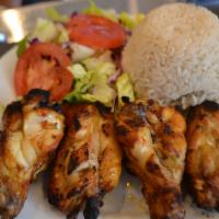 Chicken Wings · Marinated chicken wings grilled to taste. Served with salad and side.