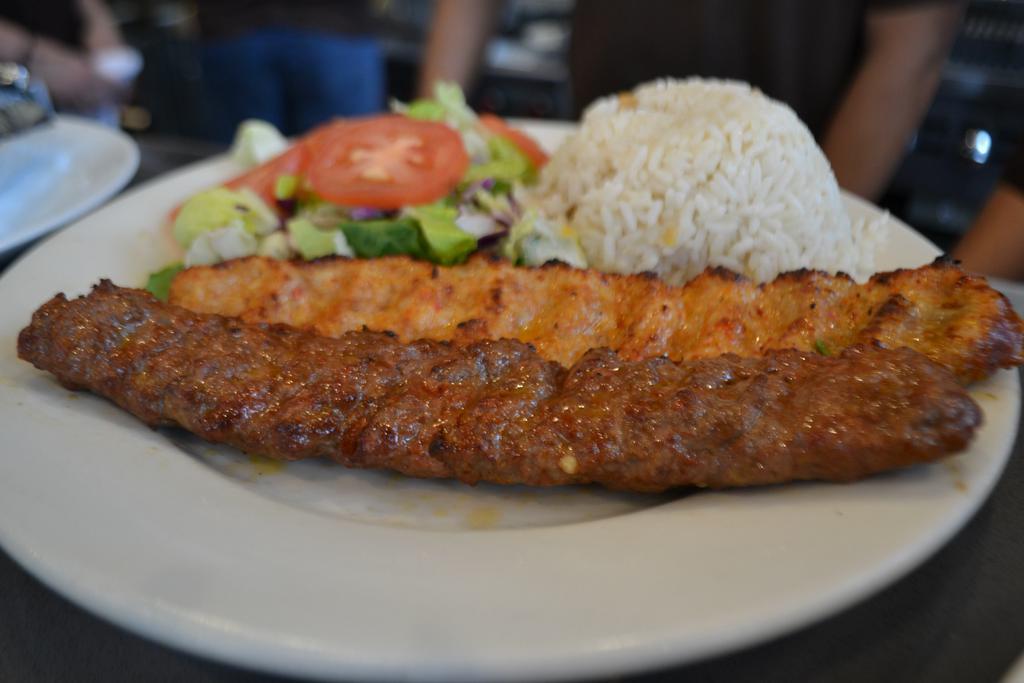 Lamb Adana and Chicken Adana Combo Kebab · Served with salad and side.