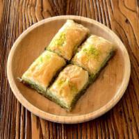 Baklava and Kinds · Sweet pastry made of extremely thin sheets of fillo dough layered with chopped nuts and hone...