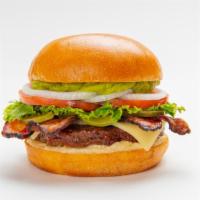Bacon Avocado Burger · A beef burger with bacon, avocado, Swiss, roasted garlic aioli and all the fixings on a toas...