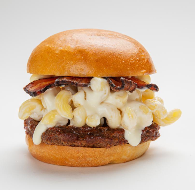 Bacon Mac Burger · A beef burger with American cheese, crispy bacon and creamy mac n cheese.