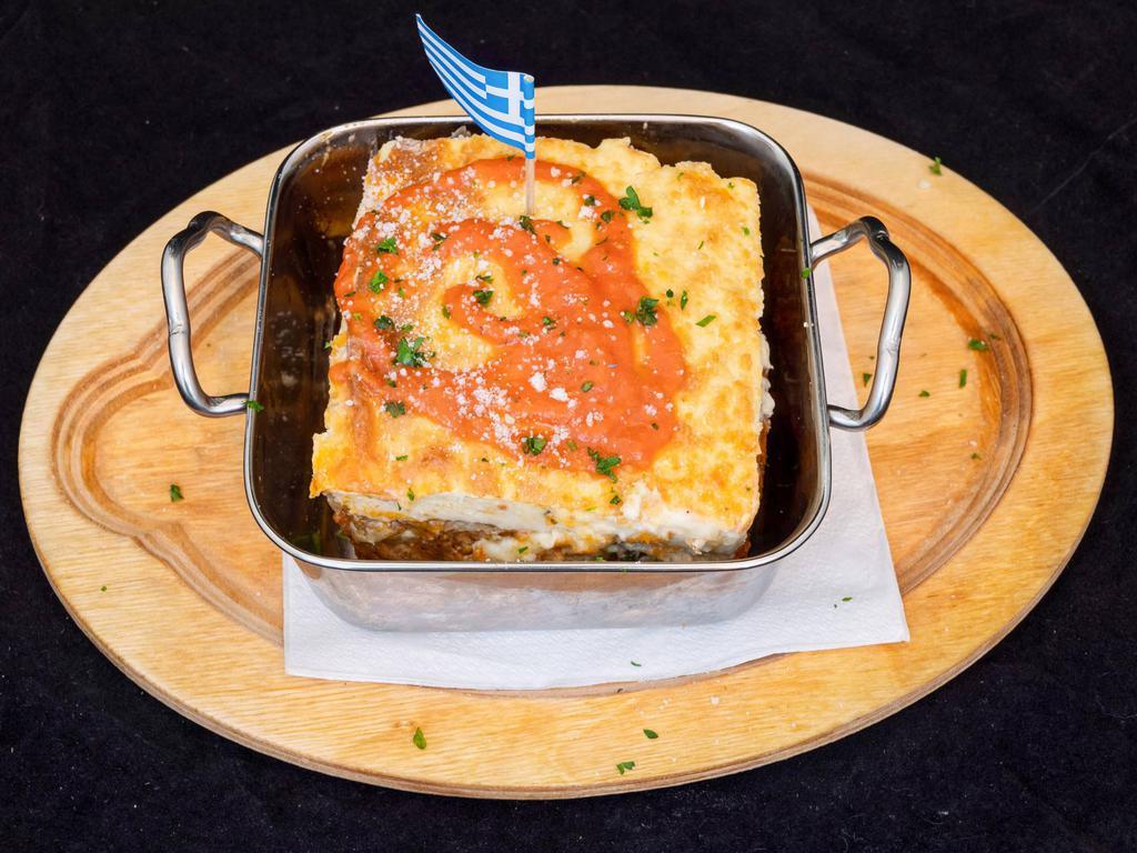 Moussaka · Layers of eggplant, potatoes, ground beef, topped with creamy bechamel.