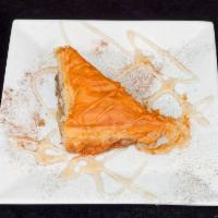 Baklava · Walnuts in phyllo pastry soaked in honey syrup.
