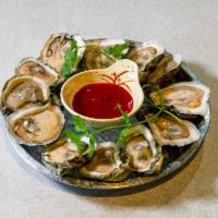 Oyster · Raw or steamed. Served with cocktail sauce.