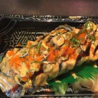 Volcano Roll · Tuna, salmon, white fish, crab, tobiko and avocado fried with spicy sauce. 