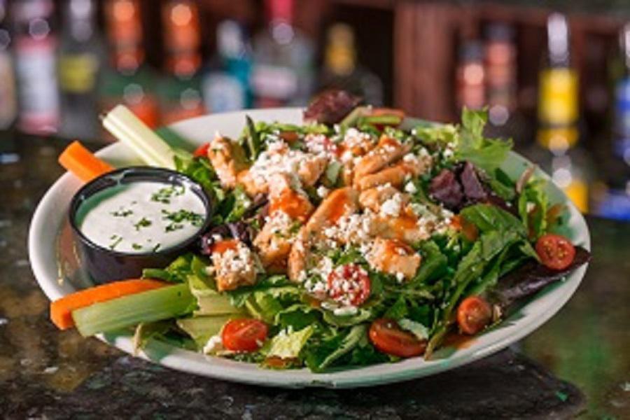 Buffalo Chicken Salad · Fresh romaine with your choice of grilled or crispy buffalo chicken strips, bacon & parmesan topped with buffalo & bleu cheese dressing.

