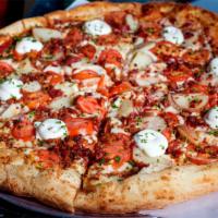 Ol' Hickory Pizza · Hickory-smoked bacon, baby red potatoes, Roma tomatoes with a dollop of sour cream.