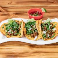 Birria Taco's  This has no Cheese · 3 toasted corn tortilla dipped in a red chili consommé and stuffed with stewed beef then top...