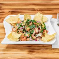 Pico de Gallo and chips · Chopped tomato, onion, cilantro, lime accompanied with crispy corn tortillas.