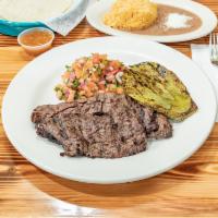 Churrasco con Pico de Gallo y Nopales · Grilled skirt steak & cactus topped with tomato, onions & cilantro.
Accompanied with rice, b...