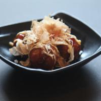 Takoyaki · Ball-shaped Japanese snack made with a wheat flour-based batter and filled with minced octop...