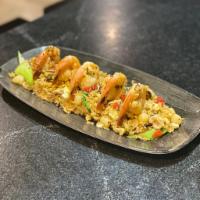 Chaufa de Mariscos · Peruvian fried rice, scrambled egg, shrimp, scallops, calamari, toasted sesame, clams, ginge...