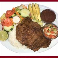 Carne Asada Platter · Grilled steak. White rice, refried beans, salad, pico de Gallo & Avacado.