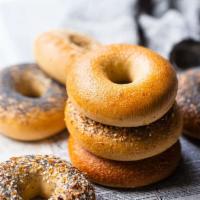 Plain Bagel · Boiled and baked round bread roll. Bread made from yeast. 