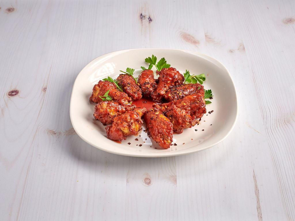 Chicken Wings · Served with choice of sauce: bbq, buffalo, roasted garlic bbq and teriyaki, kickin' bourbon.
