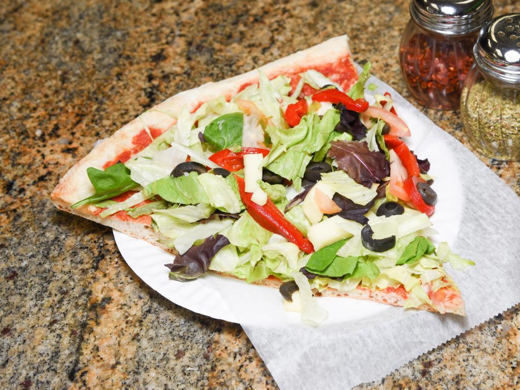 Salad Pizza · Garlic pie overloaded with our fresh greens, peppers and black olives, topped with diced mozzarella.
