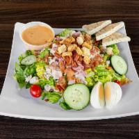 Cobb Salad · Black forest ham, oven classic turkey, bacon crubles, hard boiled egg, blue cheese crumbles,...