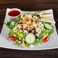 Raspberry Chicken Salad · 5 oz. grilled breast of chicken, blue cheese crumbles, walnuts, cherry tomato, cucumber, dri...