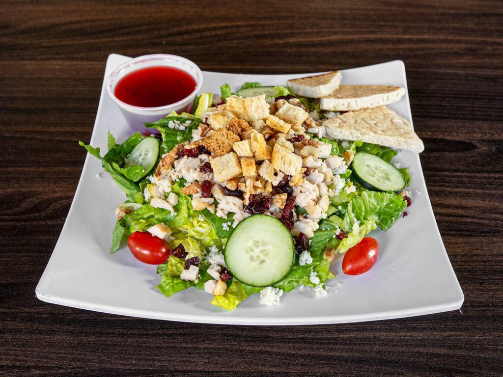 Raspberry Chicken Salad · 5 oz. grilled breast of chicken, blue cheese crumbles, walnuts, cherry tomato, cucumber, dried cherries, shredded carrots and croutons served on a bed of crisp romaine lettuce with raspberry vinaigrette dressing.