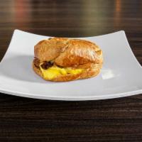 Breakfast Bagel Sandwich · Toasted bagel of your choice, fluffy scrambled eggs, your choice of bacon, ham, sausage or c...