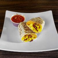 Breakfast Burrito · Your choice of tortilla stuffed with fluffy scrambled eggs, your choice of bacon, ham, sausa...