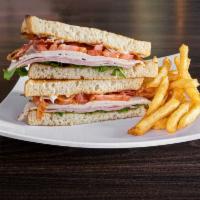 Classic Club · Black forest ham, oven classic turkey, bacon, lettuce, tomato, mayo, served on our sourdough...