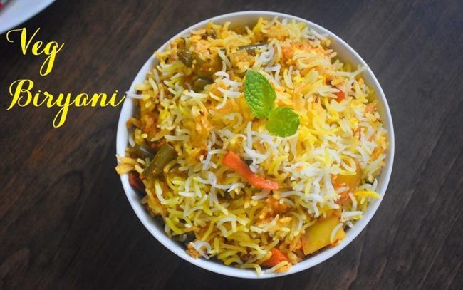 Hyderabad Veg Dum Biryani Small Shallow (Take out only). · Authentic Hyderabadi style of Biryani with fresh Mix Veggies cooked with long basmati rice.