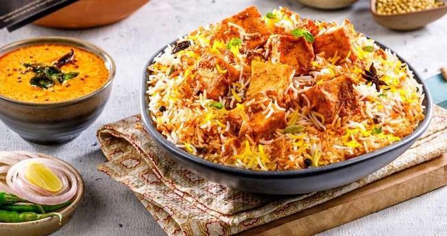 Paneer Biryani. · Long grain basmati rice cooked with marinated cottage cheese along with Indian herbs.