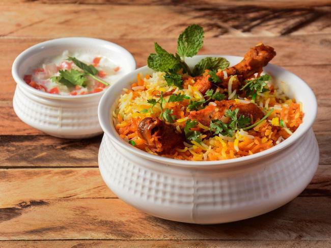 Hyderabad Chicken Dum Biryani. · Traditional Hyderabadi style Biryani with chicken on the bone cooked with long grain basmati rice.