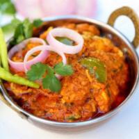 Kadai  Chicken. · Boneless chicken cooked with bell pepper, onion tossed with fresh herbs and spices.